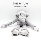 Gray plush elephant toy with a squeaker inside on a white background