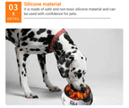 Dog eating out of bowl with orange slow feeder insert