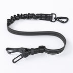 Black dog seat belt with adjustable clip on a white background
