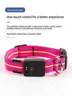 Pink and yellow pet collar with a control device on a white background