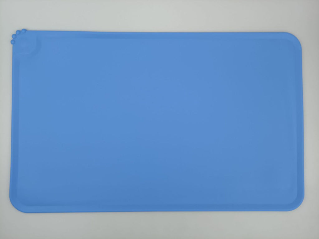 Blue silicone mat on a gray background
