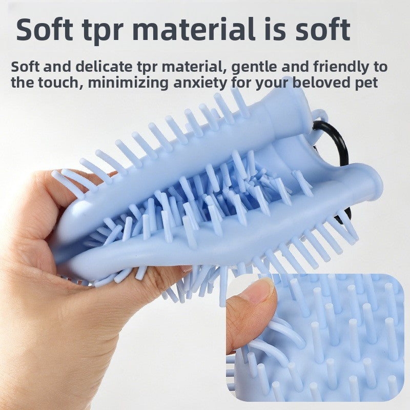 Blue pet grooming brush held by a hand with text about soft tpr material