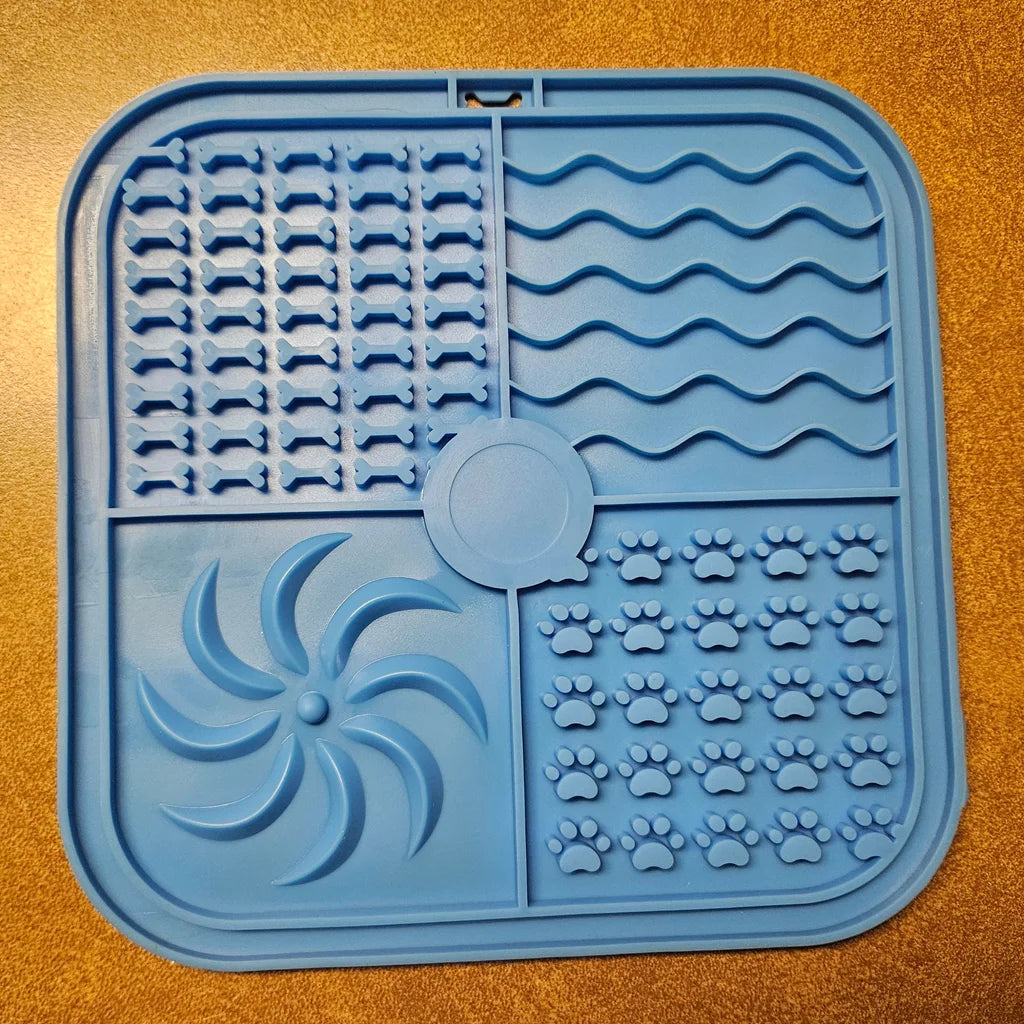 Blue silicone mat with various textured patterns on a brown background