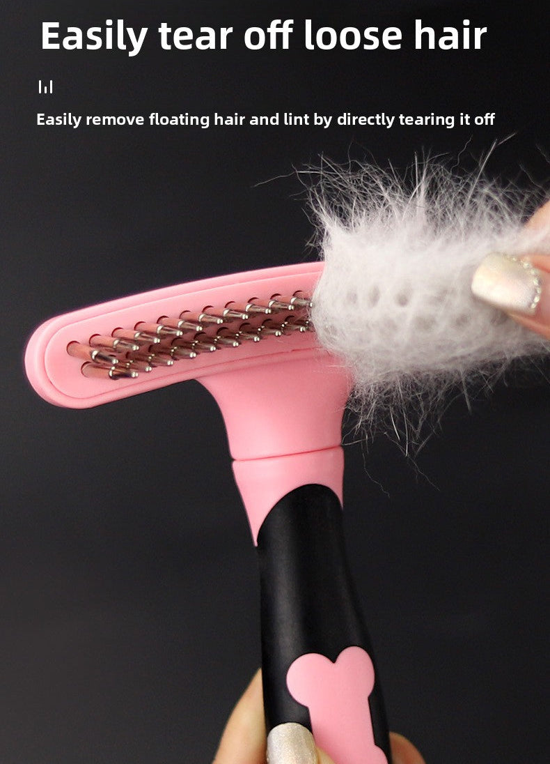 Pink brush showing hair removal on a black background