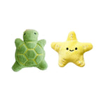 Green turtle and yellow star plush toys on a white background