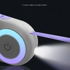 Close-up of a glowing leash with purple tape on a dark background