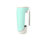 Mint green and white pet water bottle with a strap on a white background